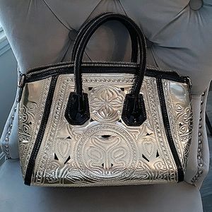 Gold and black patent handbag
